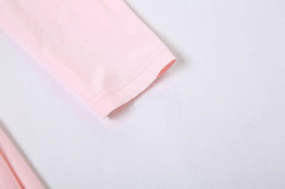 Pink fabric on a light gray background