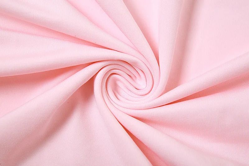 Close-up of pink fabric with a swirl pattern