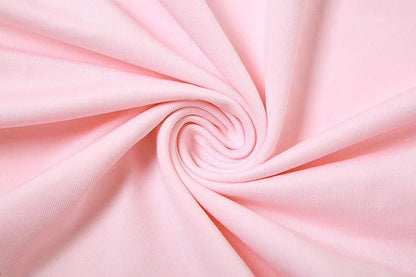 Close-up of pink fabric with a swirl pattern