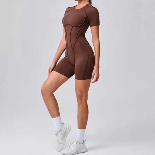 Person wearing a brown bodysuit on a gray background
