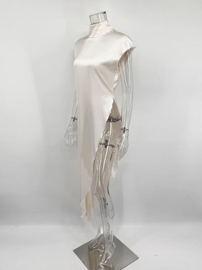 Mannequin wearing a white dress on a plain background