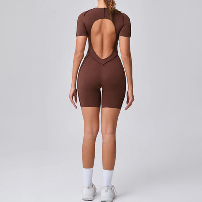 Brown open-back bodysuit worn by a model on a gray background
