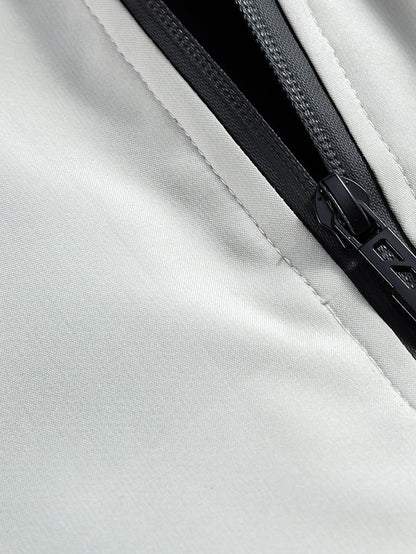 Close-up of a zipper on a white jacket