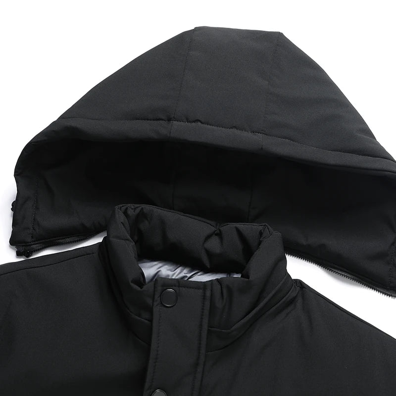 Close-up of a black hooded jacket with a white background