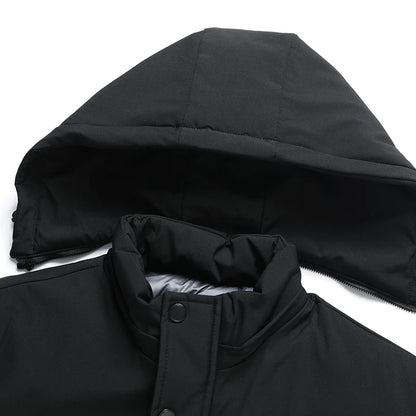 Close-up of a black hooded jacket with a white background