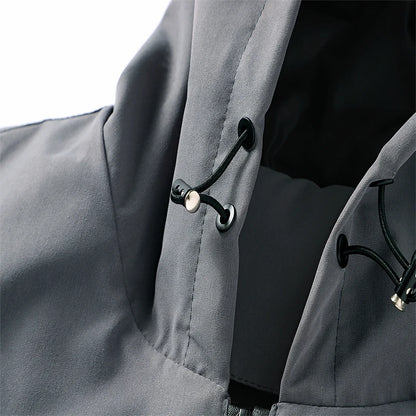 Close-up of a gray coat with black buttons on a white background