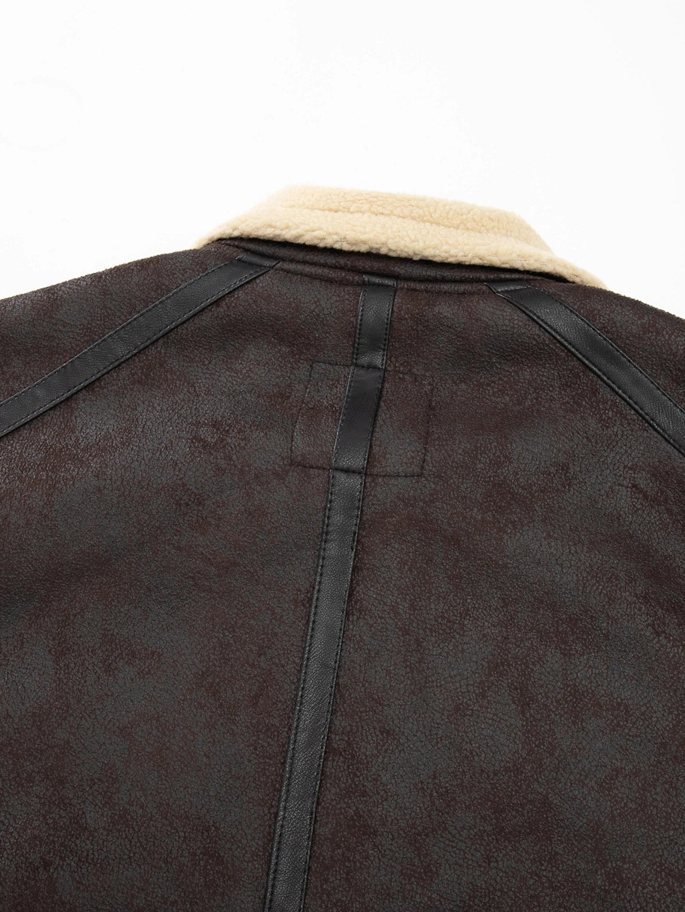 Brown leather jacket with beige fur lining on a white background