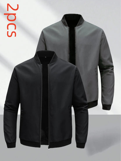 Two bomber jackets, one black and one gray, on a light gray background.