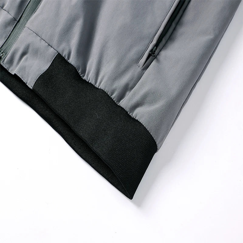 Close-up of a gray jacket with black lining on a white background