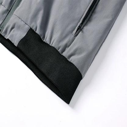 Close-up of a gray jacket with black lining on a white background
