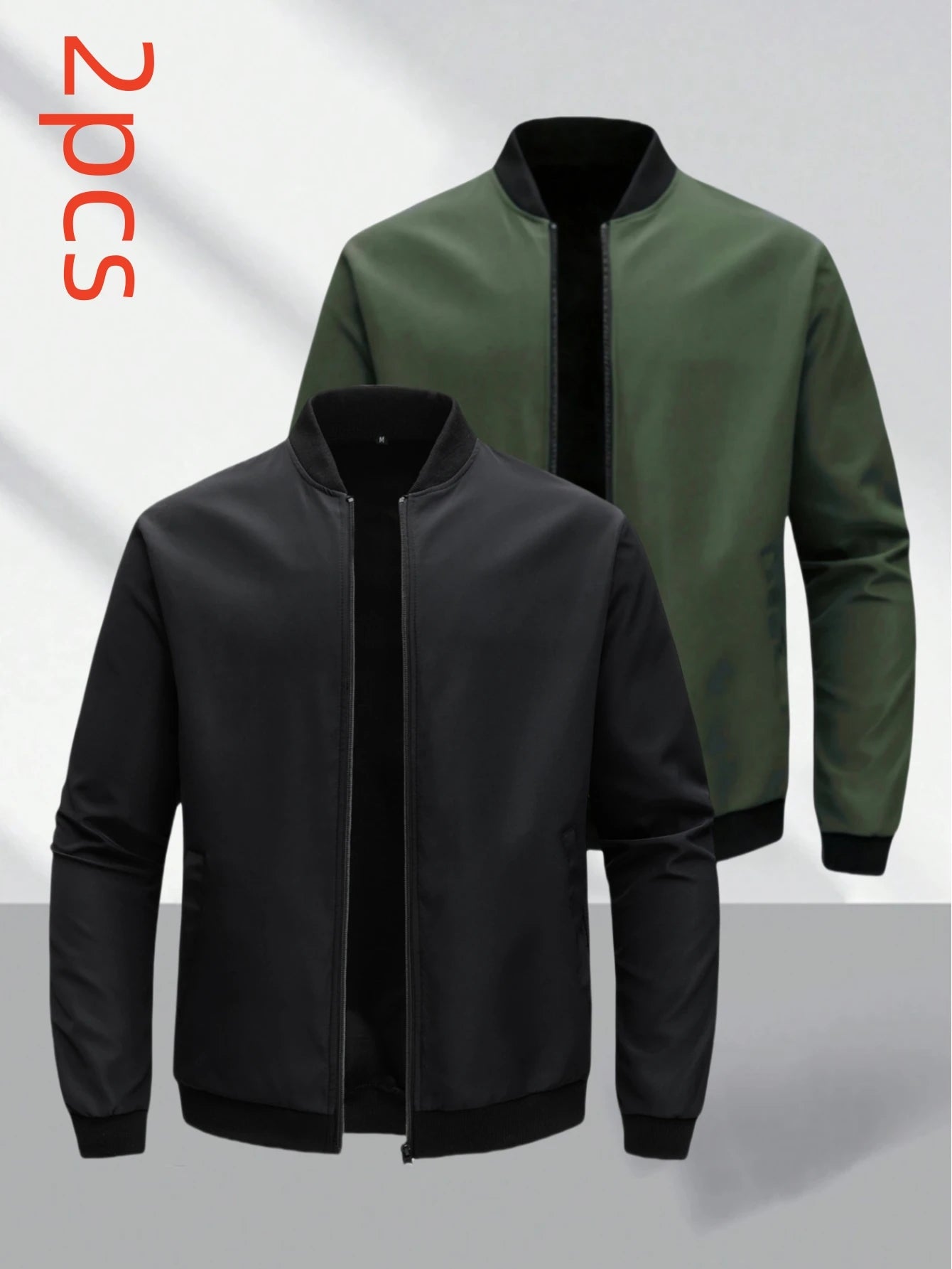 Two bomber jackets, one black and one green, on a light gray background.