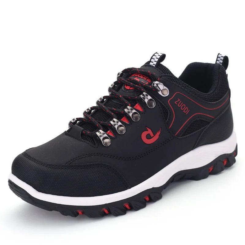 Black hiking shoe with red accents and white sole on a white background